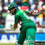 Home 21 방글라데시의 스포츠 스타 - A dynamic scene of a young Bangladeshi cricket player in action on an international stadium, wearing...